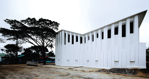 The structure, which is open to the elements, has a raised roof over the altar space