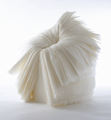 The chair is made from a by-product of the fabric-pleating process