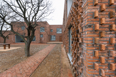 The three-sided meditation courtyard of the larger home