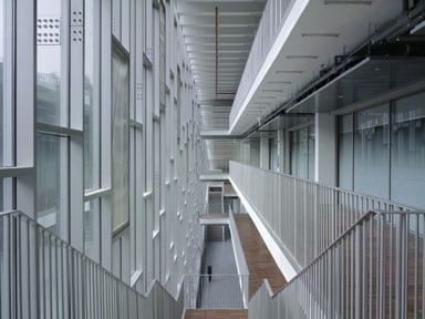 Parallel corridors and staircases run the full length of the building