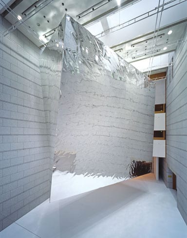 Balloon, 2007, a building-sized warped cube wrapped in aluminium foil and held afloat by helium