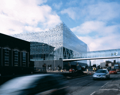 The facade of the department store combines mirrored frit with a double layer of glass