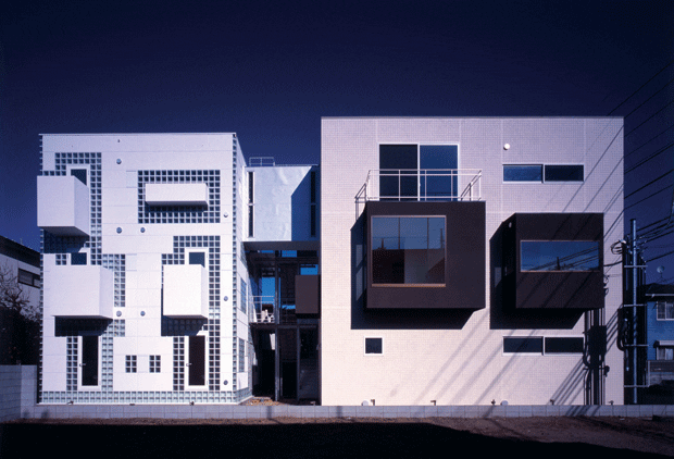 Rooms painted in dark grey cantilever from the eastern block