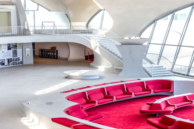 The TWA's sunken bar with bright pink seats. Photo by Max Touhey