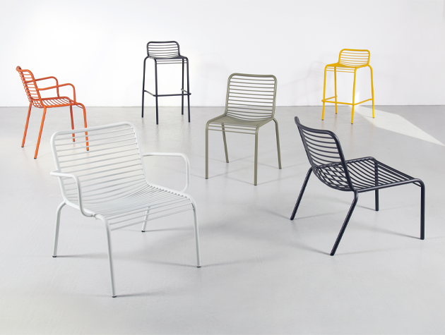 A collection of steel tube chairs in different colours