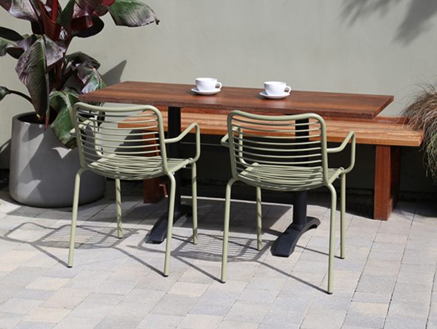 Two steel chairs at an outdoor table