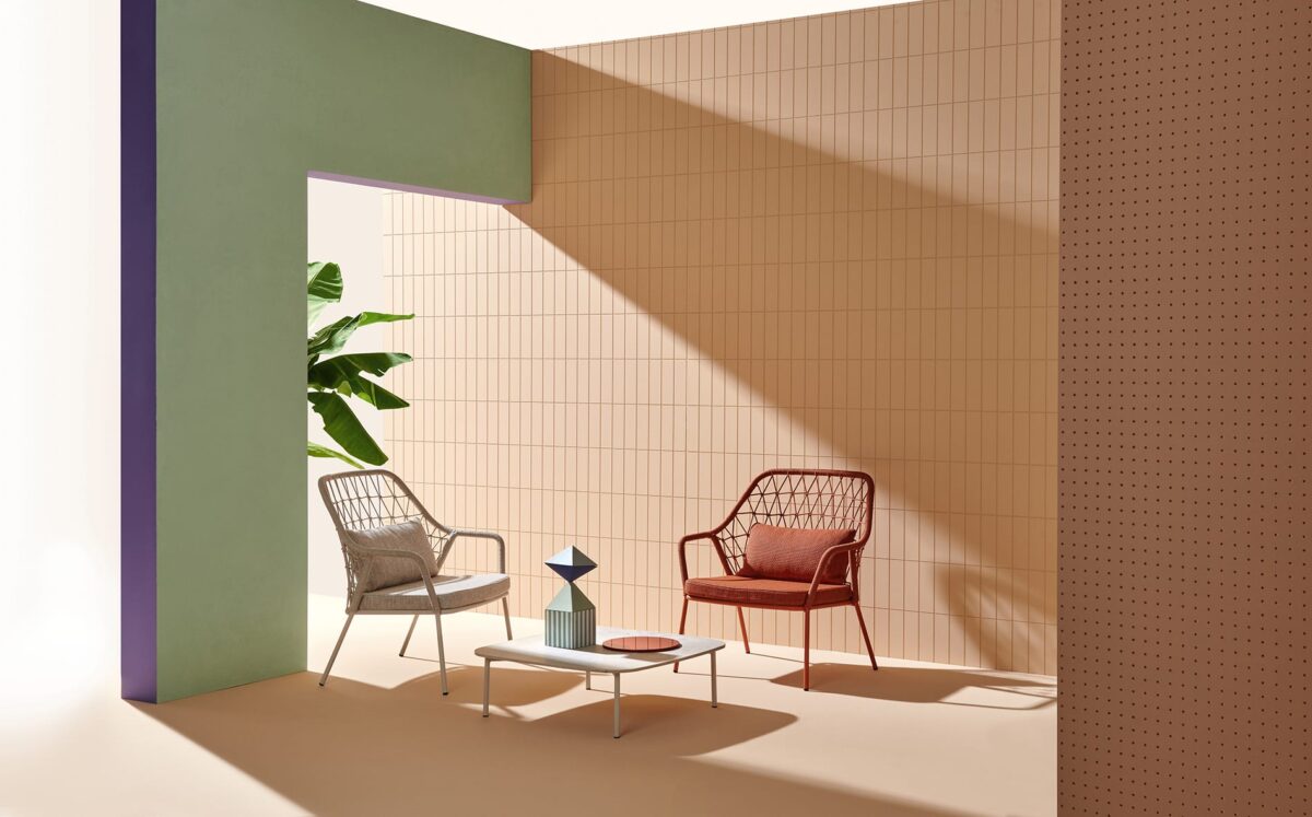 Chairs around a small coffee table and plant