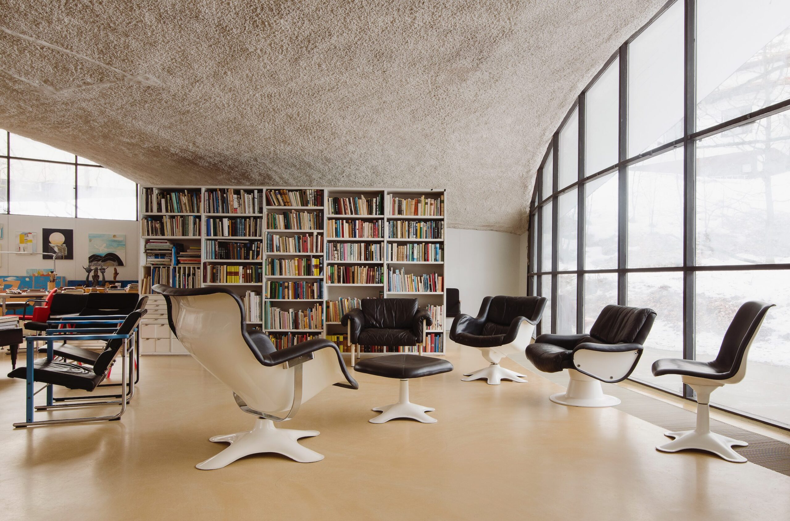 Kukkapuro House interior curved ceiling chairs