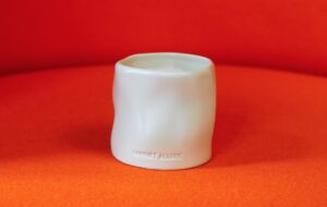 Harriet Allure Ama candle white on red background